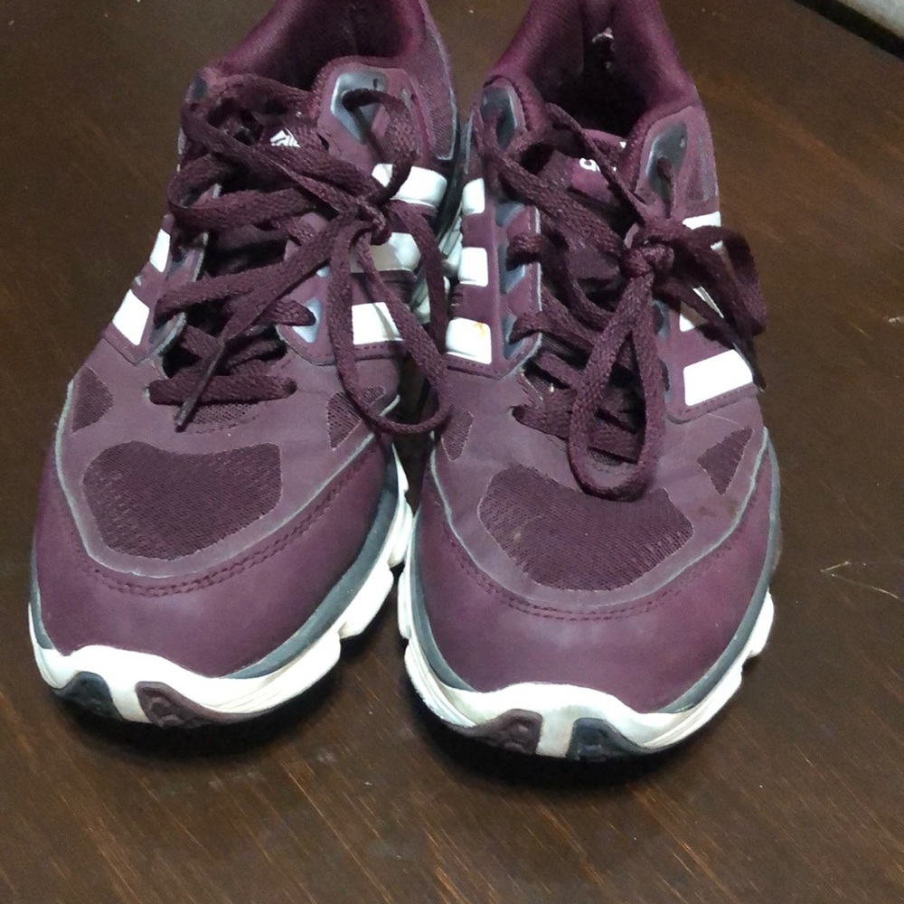 Maroon and white turf shoes